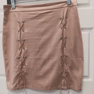 100% polyester pink Suede skirt . Very lightweight.